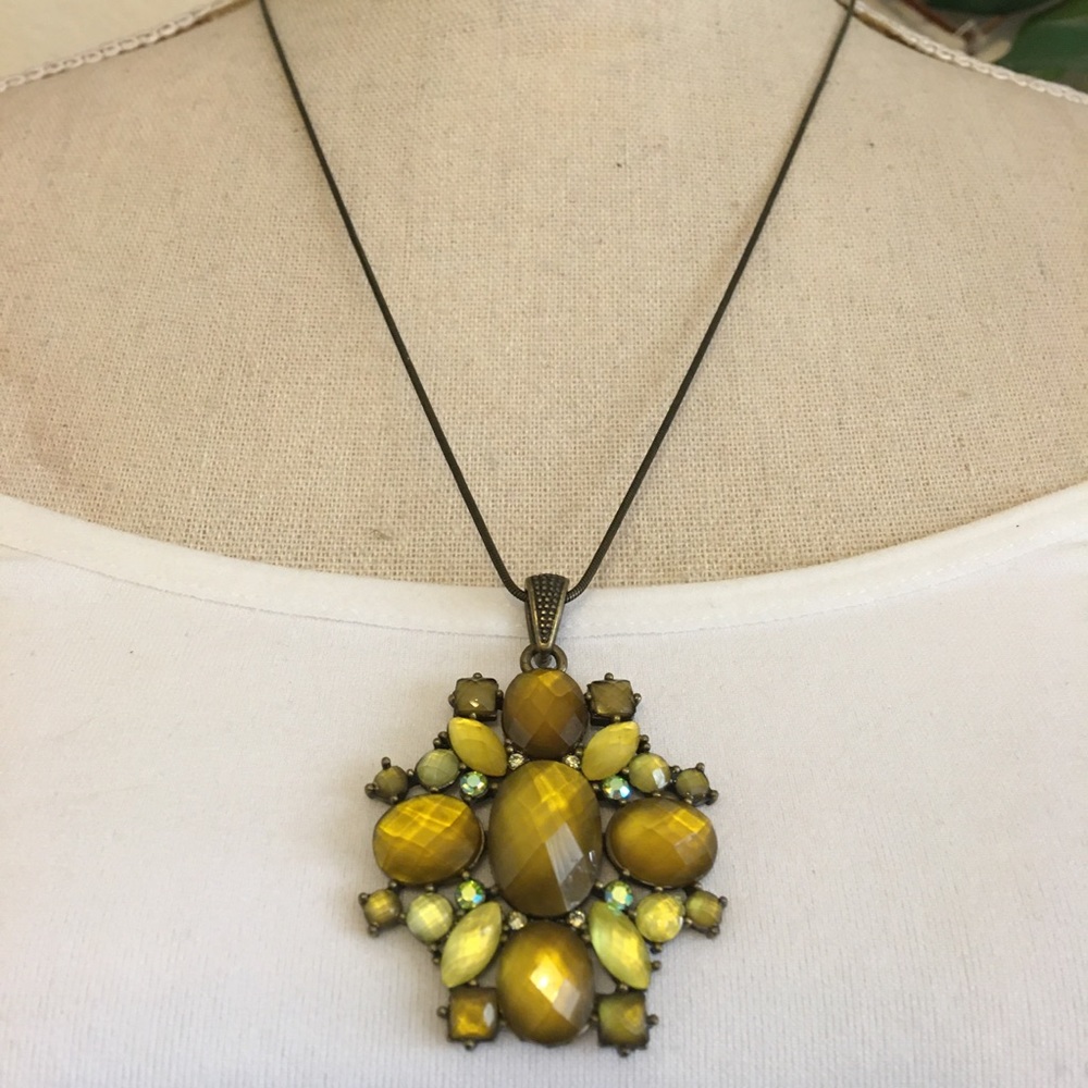 Brass tone glass gem covered medallion necklace